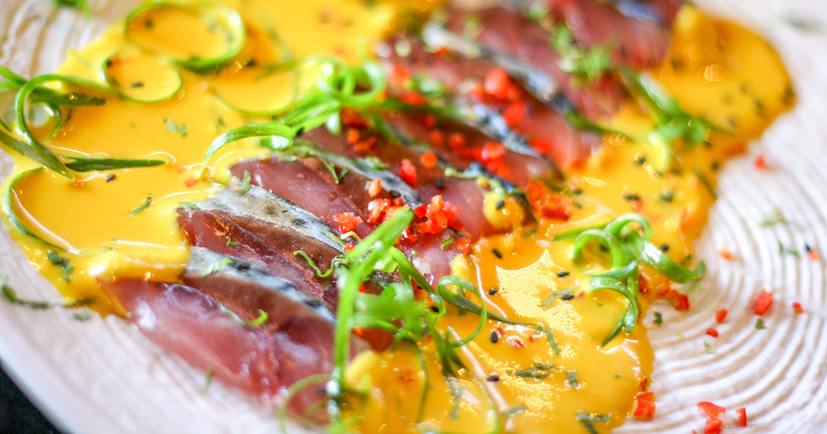 thinly sliced fish with aji amarillo sauce 